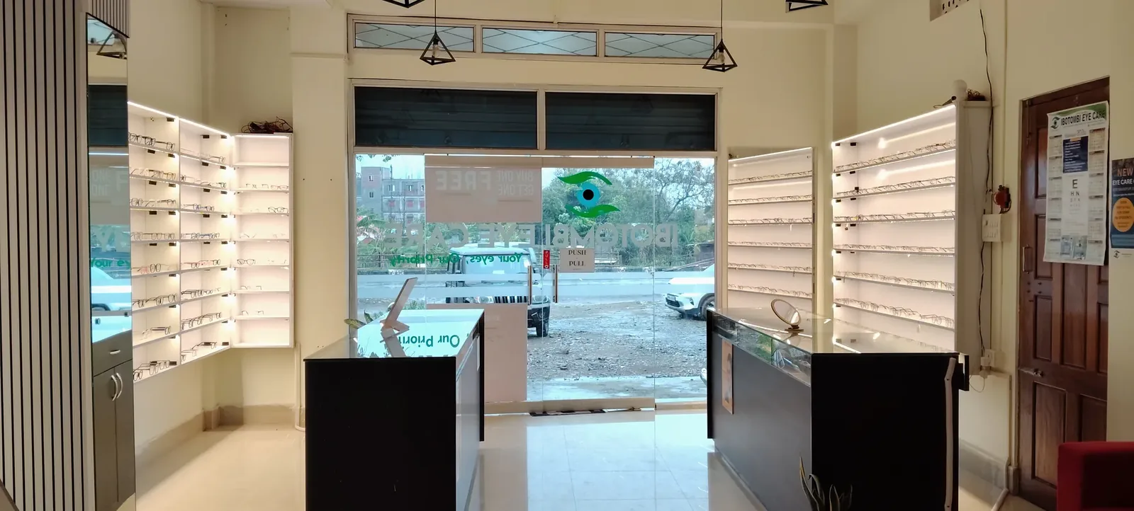The optical showroom at Ibotombi Eye Care with a full wall of spectacle frames